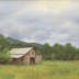 Old barn under a passing stormcloud